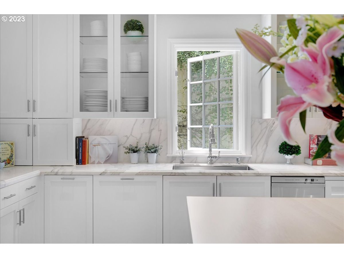 554 Southwest 48th Drive Portland, OR 97221 - Photo 12 of 48 a kitchen with a sink and a window