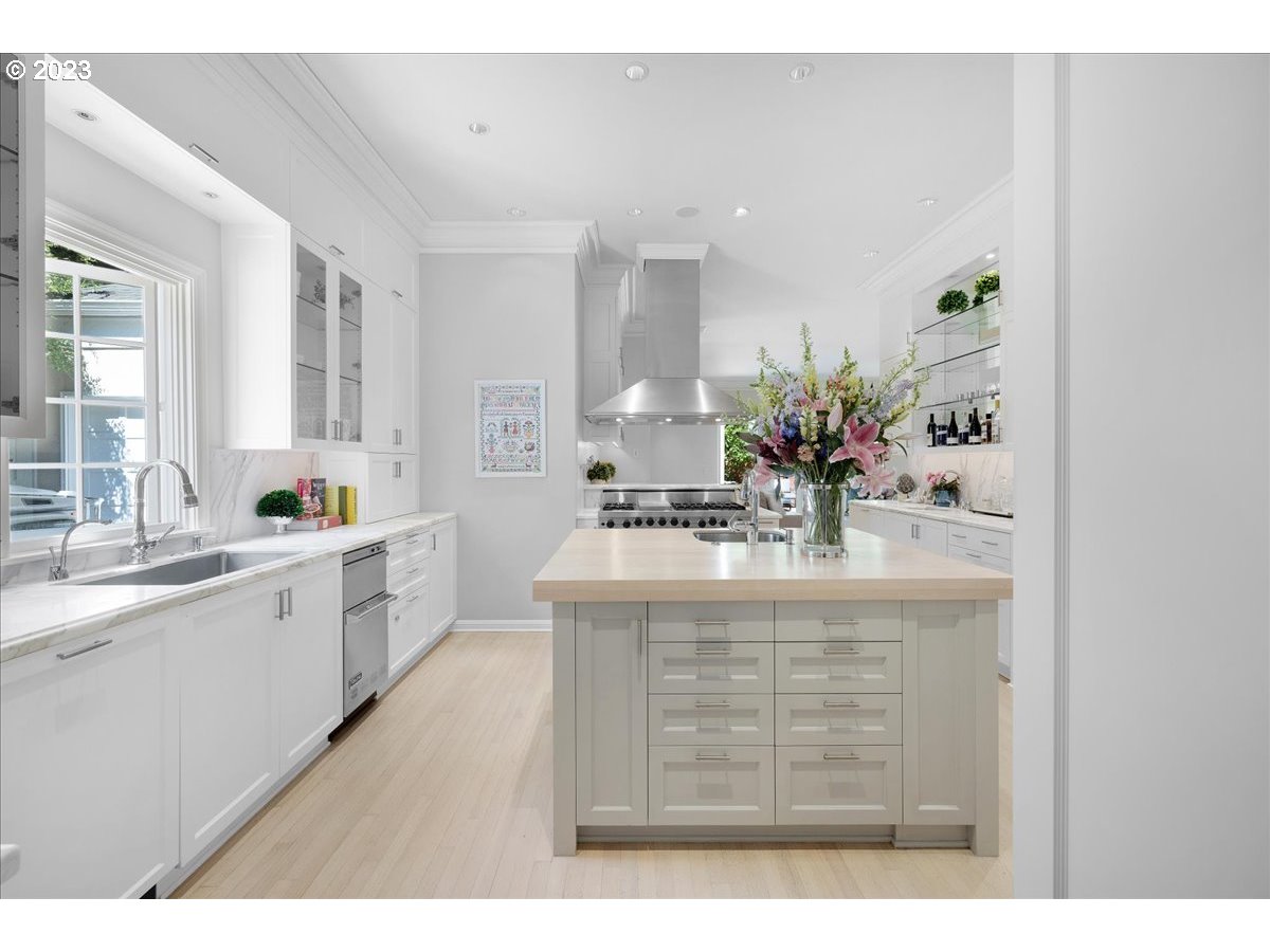 554 Southwest 48th Drive Portland, OR 97221 - Photo 13 of 48 a view of living room with kitchen island granite countertop wooden floor