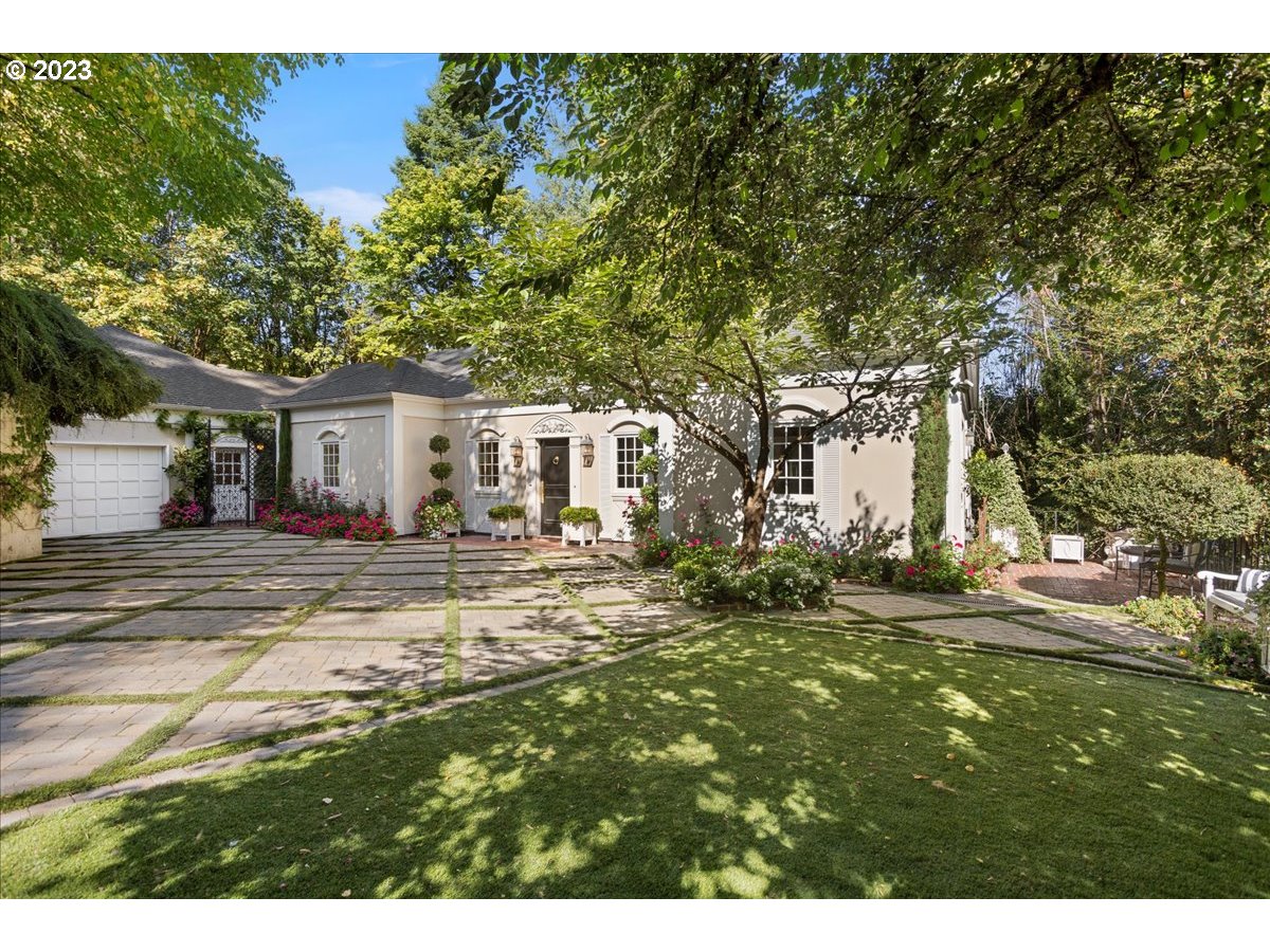554 Southwest 48th Drive Portland, OR 97221 - Photo 2 of 48 a view of a yard with a house and a tree
