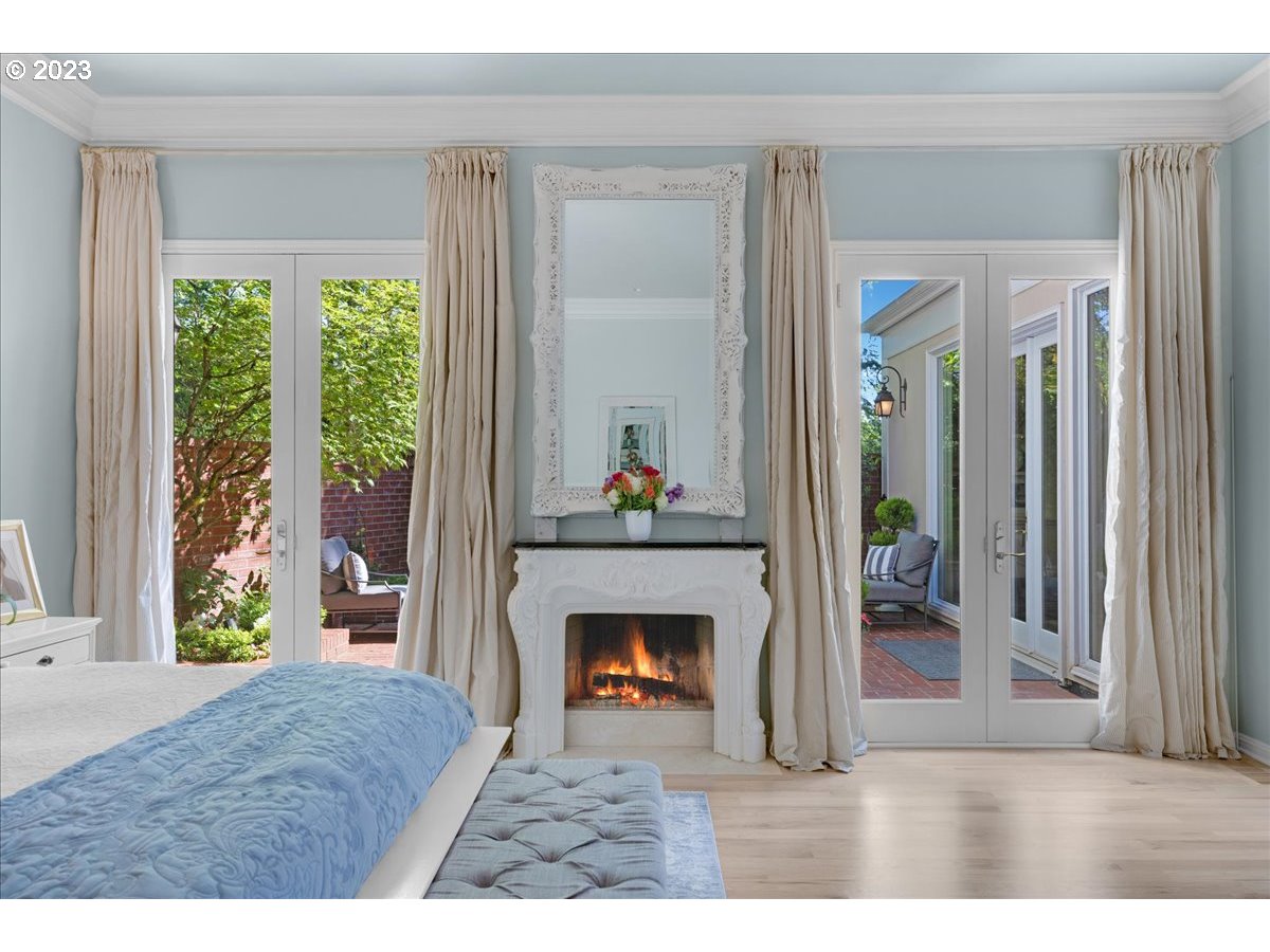 554 Southwest 48th Drive Portland, OR 97221 - Photo 22 of 48 a living room with a fireplace a rug and a window