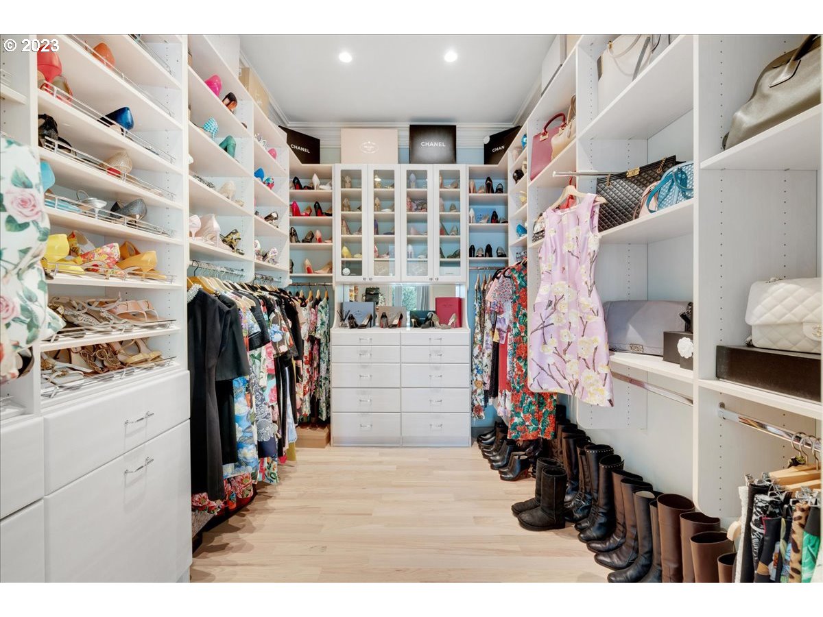 554 Southwest 48th Drive Portland, OR 97221 - Photo 23 of 48 a view of walk in closet with clothes and shoes
