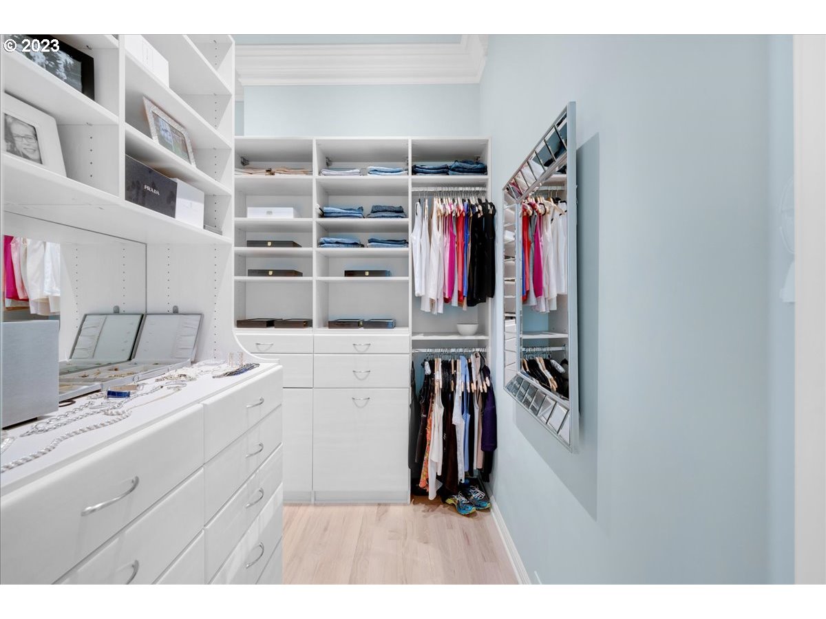 554 Southwest 48th Drive Portland, OR 97221 - Photo 24 of 48 a view of walk in closet with clothes and shoes