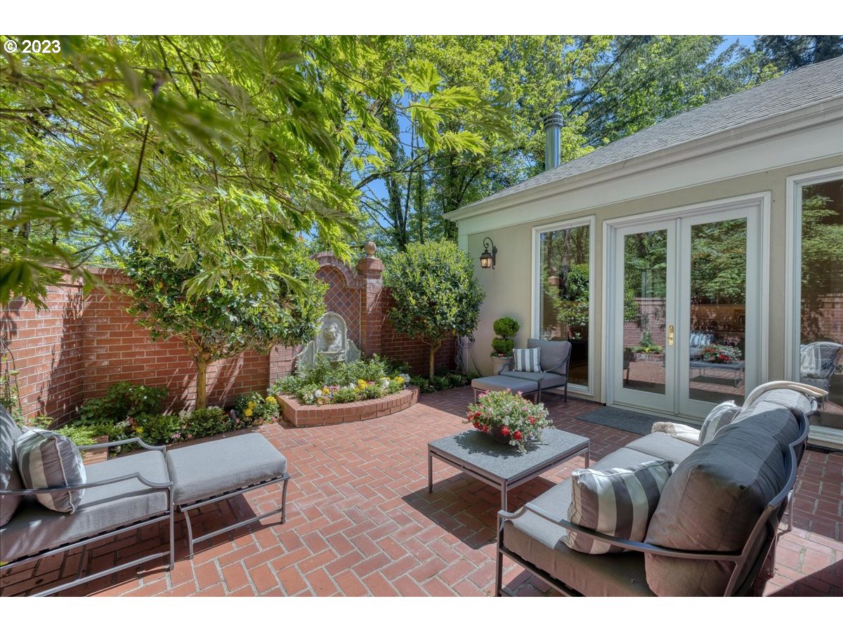 554 Southwest 48th Drive Portland, OR 97221 - Photo 28 of 48 a backyard of a house with outdoor seating