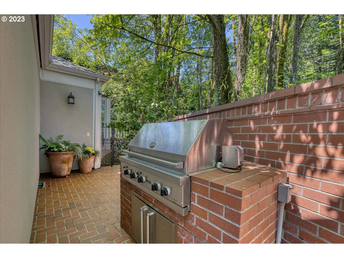 554 Southwest 48th Drive Portland, OR 97221 - Photo 30 of 48 a wooden bench sitting in front of a building