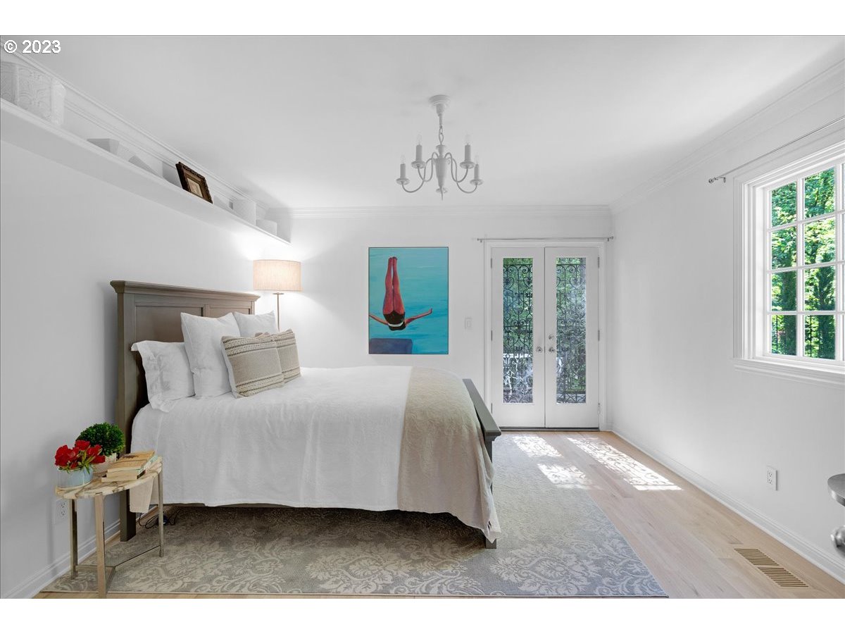 554 Southwest 48th Drive Portland, OR 97221 - Photo 32 of 48 a bedroom with a large bed and a window