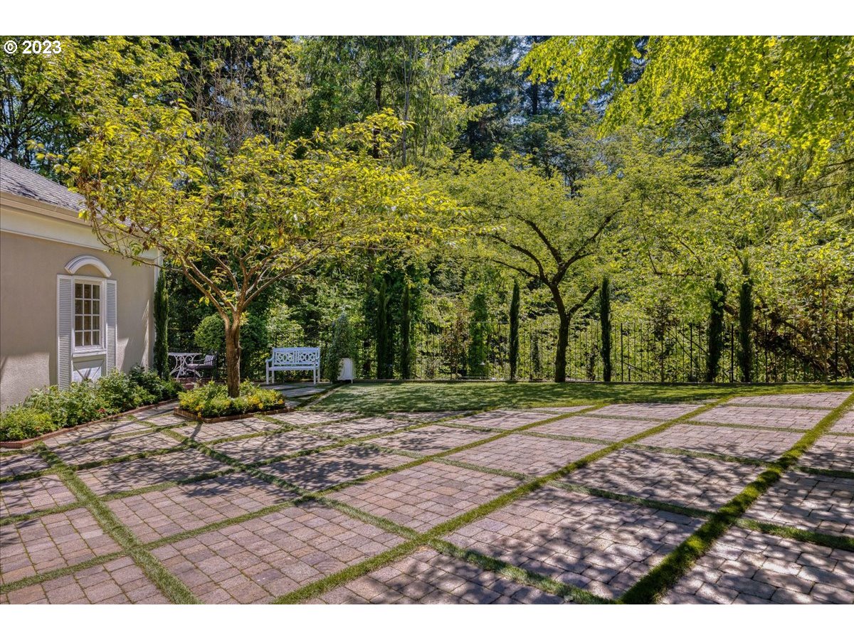 554 Southwest 48th Drive Portland, OR 97221 - Photo 35 of 48 a view of a backyard with large trees