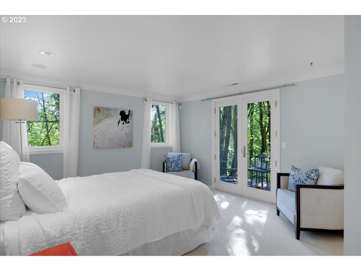 554 Southwest 48th Drive Portland, OR 97221 - Photo 40 of 48 a bedroom with a large bed and a couch