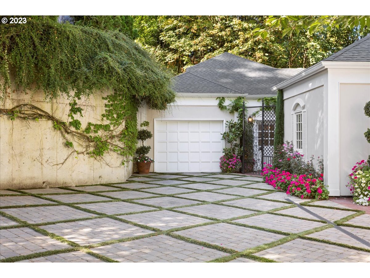 554 Southwest 48th Drive Portland, OR 97221 - Photo 42 of 48 a side view of a house with a yard