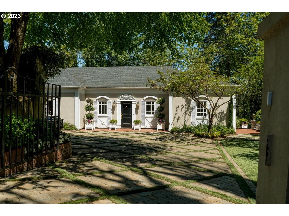 554 Southwest 48th Drive Portland, OR 97221 - Photo 46 of 48 a front view of a house with a garden