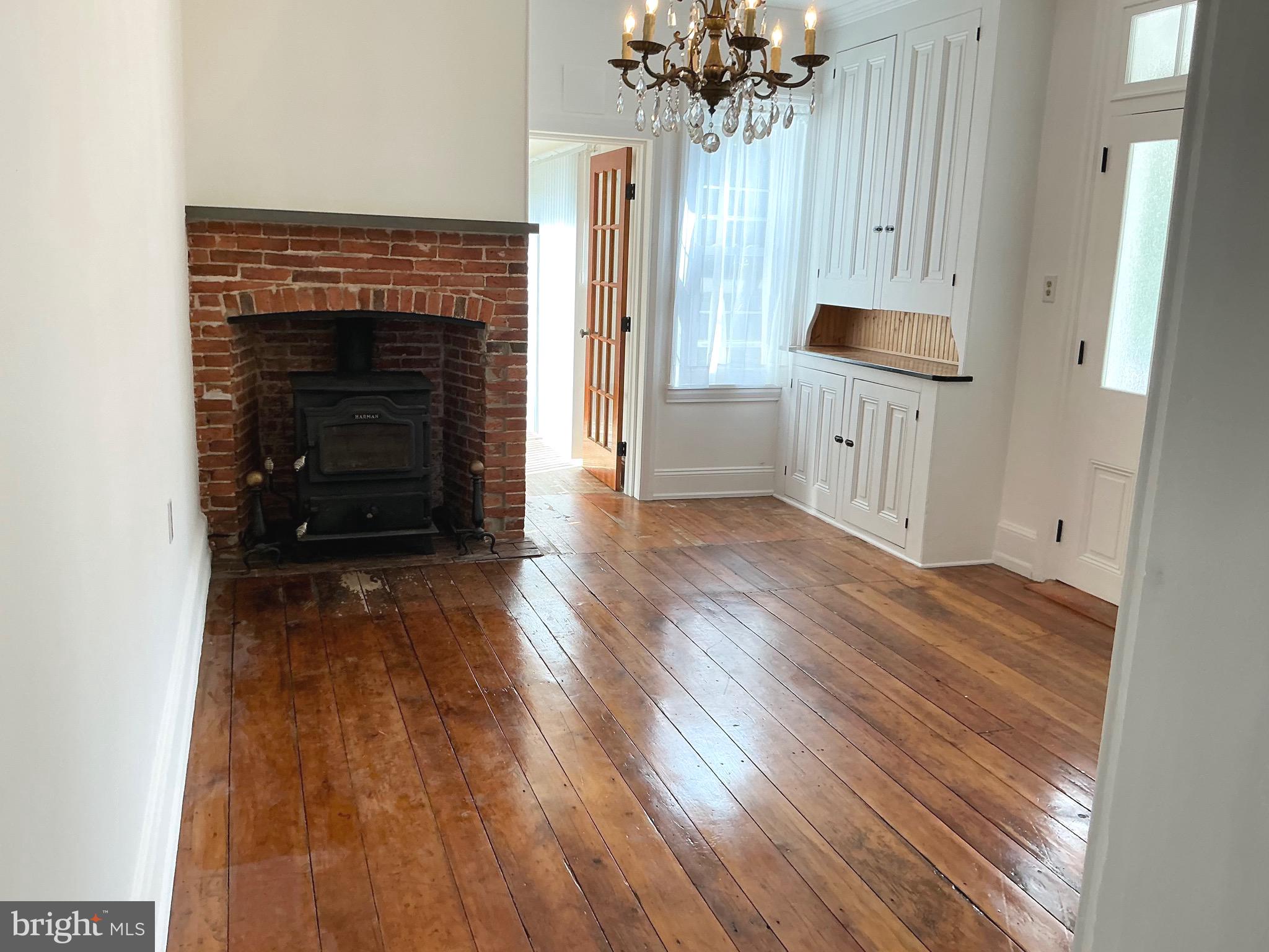 30 South Village Avenue Exton, PA 19341 - Photo 15 of 31 wooden floor in an empty room with a fireplace