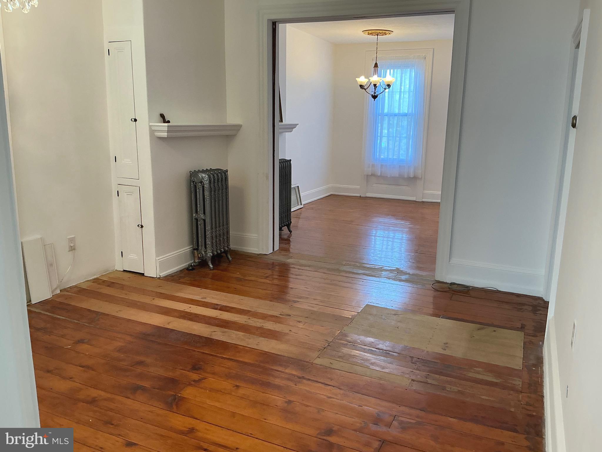 30 South Village Avenue Exton, PA 19341 - Photo 18 of 31 an empty room with wooden floor and a fireplace