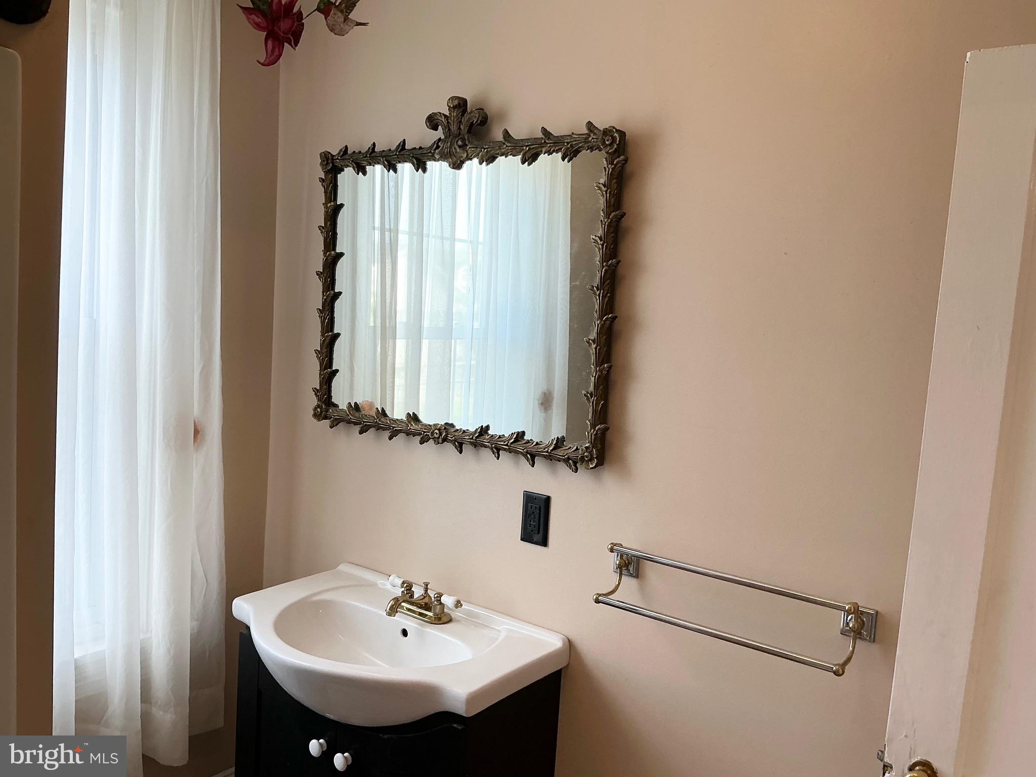 30 South Village Avenue Exton, PA 19341 - Photo 21 of 31 a bathroom with a sink and a mirror