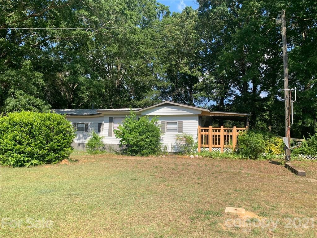 887 Meadowbrook Road, Unit 3 Chester, SC 29706 - Photo 1 of 15 a front view of a house with a yard