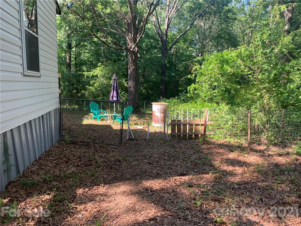 887 Meadowbrook Road, Unit 3 Chester, SC 29706 - Photo 12 of 15 a view of a yard with plants and trees
