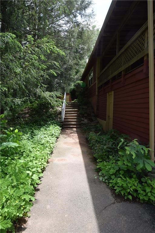 a view of a pathway both side of house