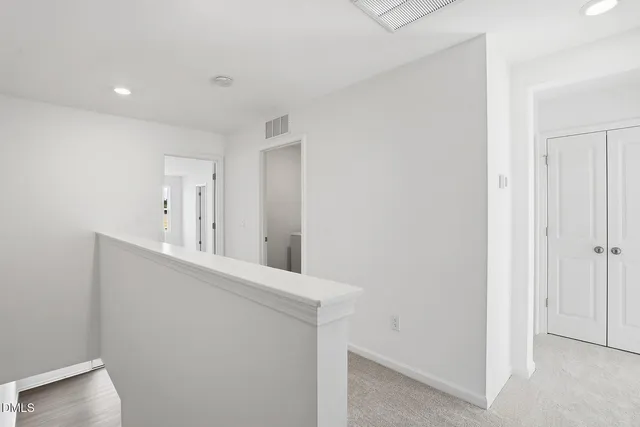 a view of a hallway with a white stove