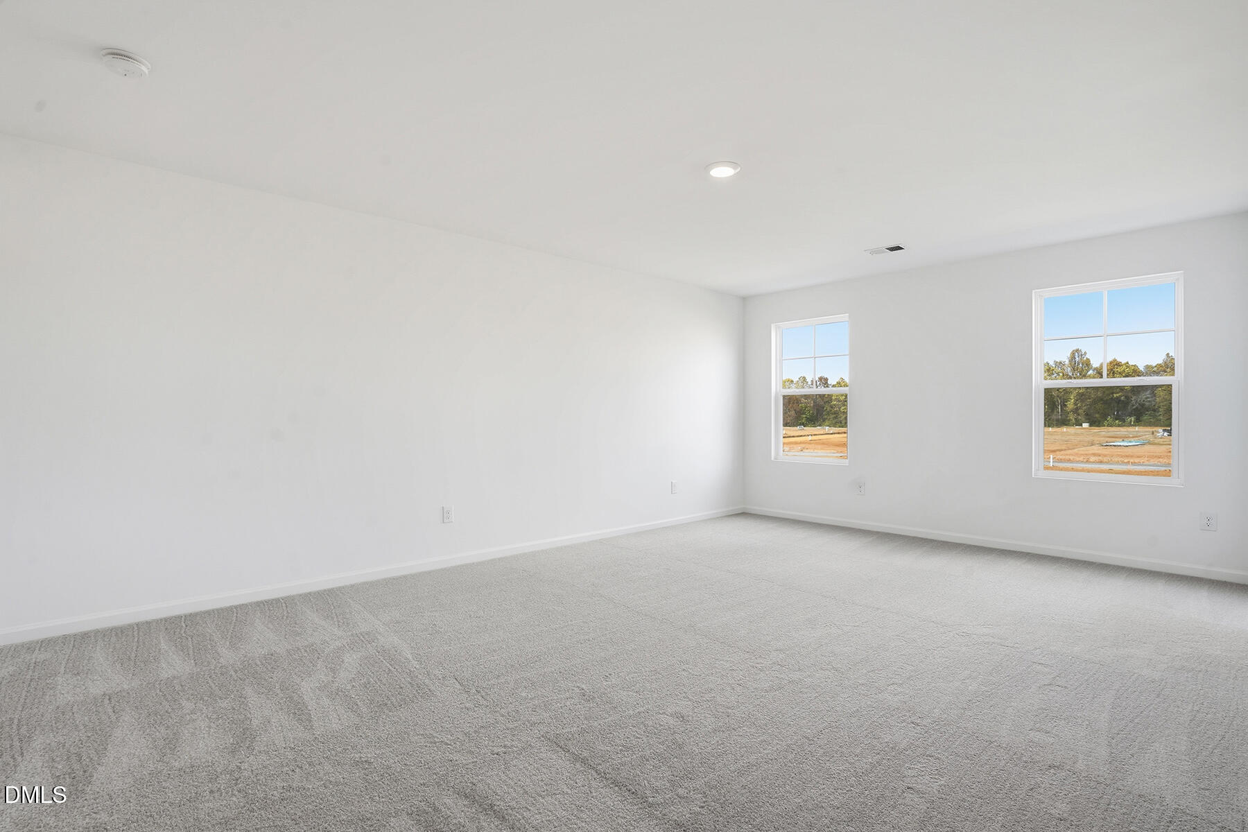 84 Blossom Fld Way Angier, NC 27501 - Photo 23 of 30 an empty room with windows