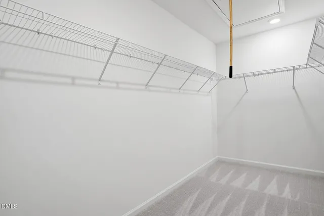 a bathroom with a shower sink and mirror