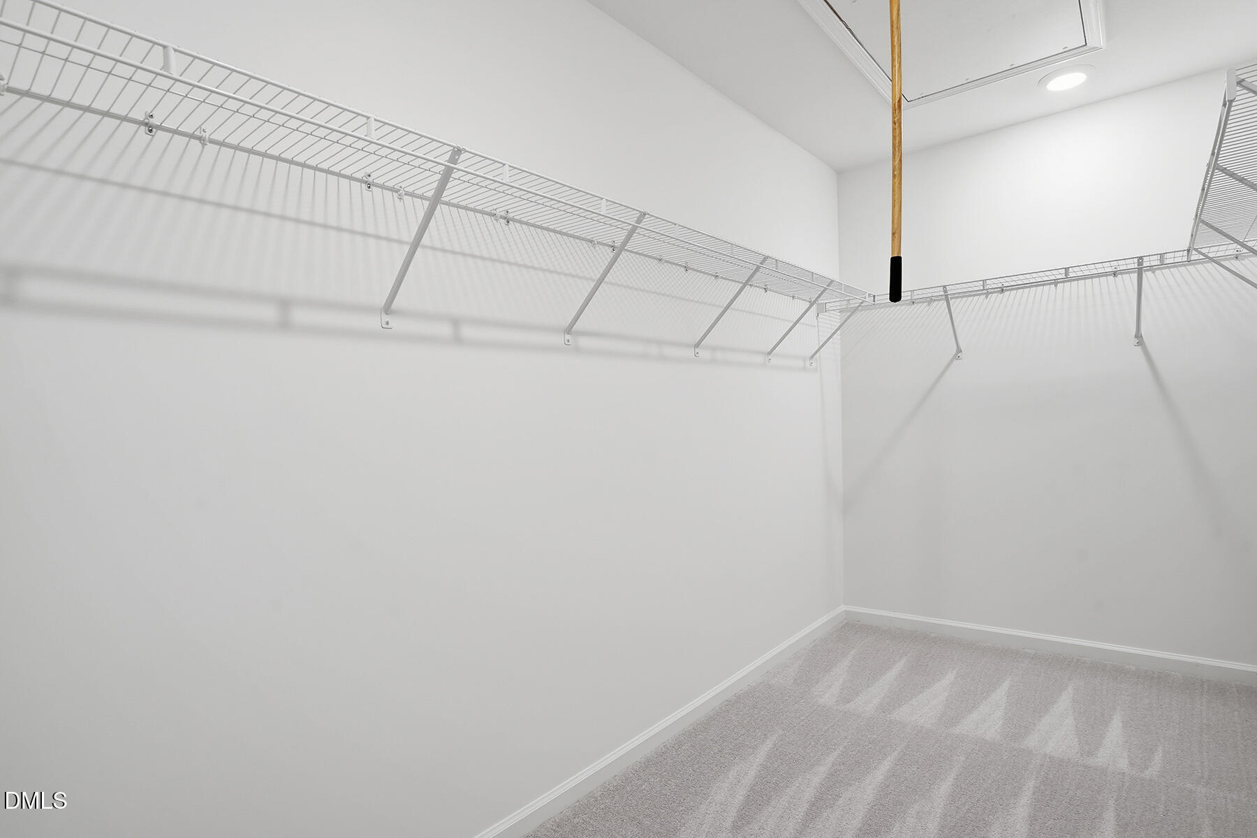 84 Blossom Fld Way Angier, NC 27501 - Photo 25 of 30 a view of a room with racks on the wall