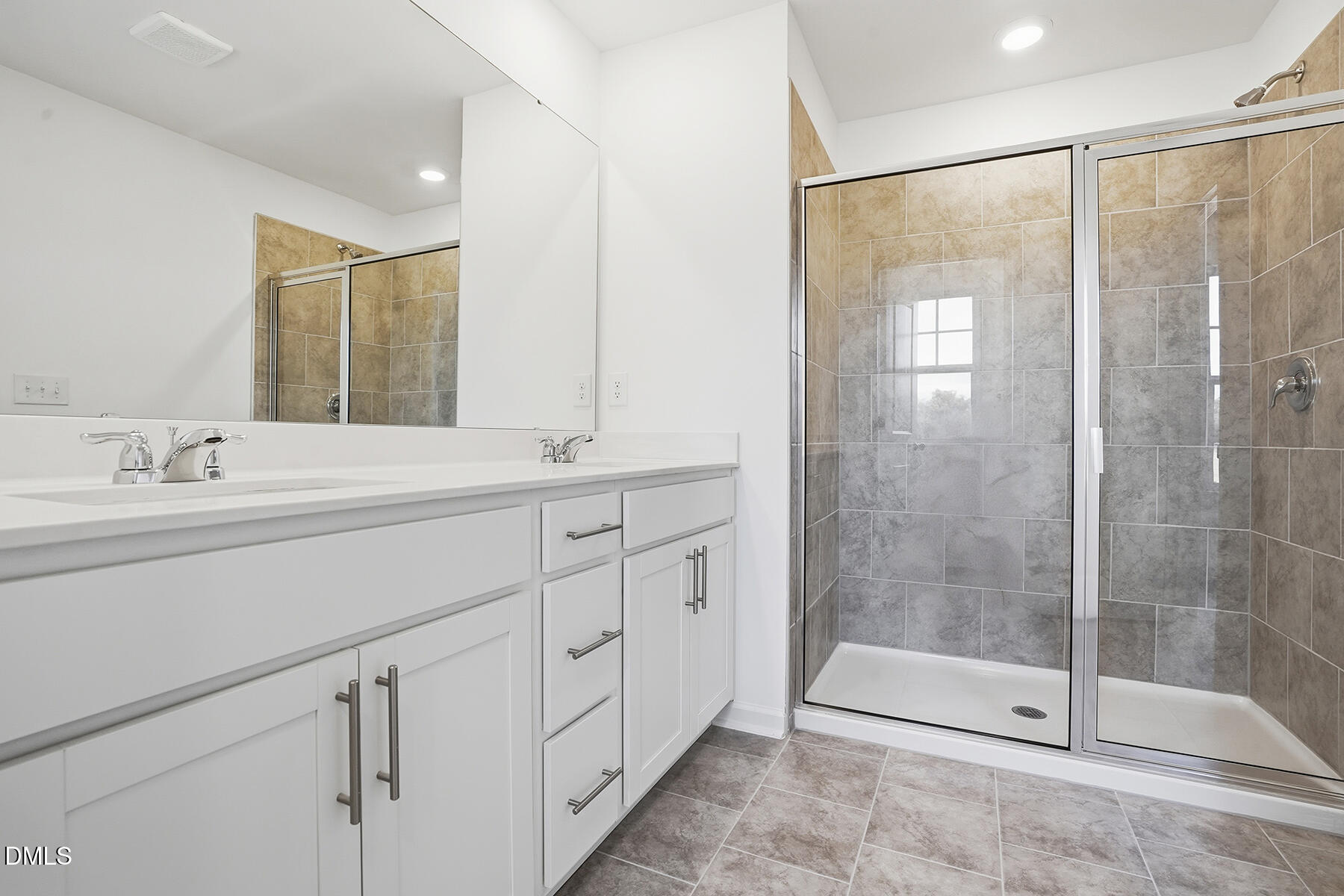 84 Blossom Fld Way Angier, NC 27501 - Photo 26 of 30 a bathroom with a shower sink and mirror