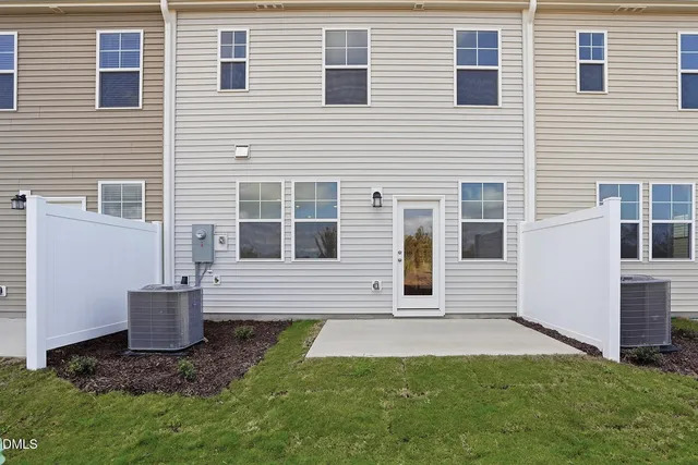 a view of house with backyard