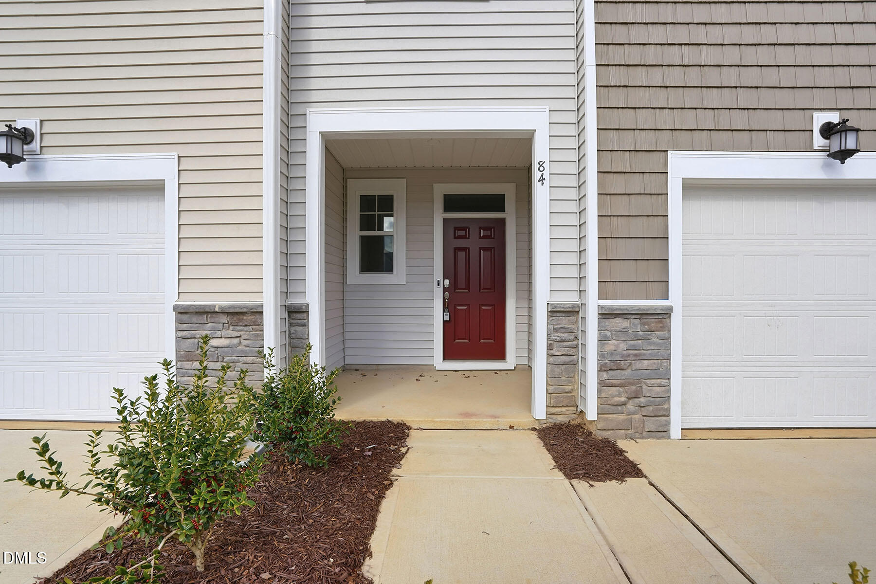 84 Blossom Fld Way Angier, NC 27501 - Photo 5 of 30 a front view of a house with a garage