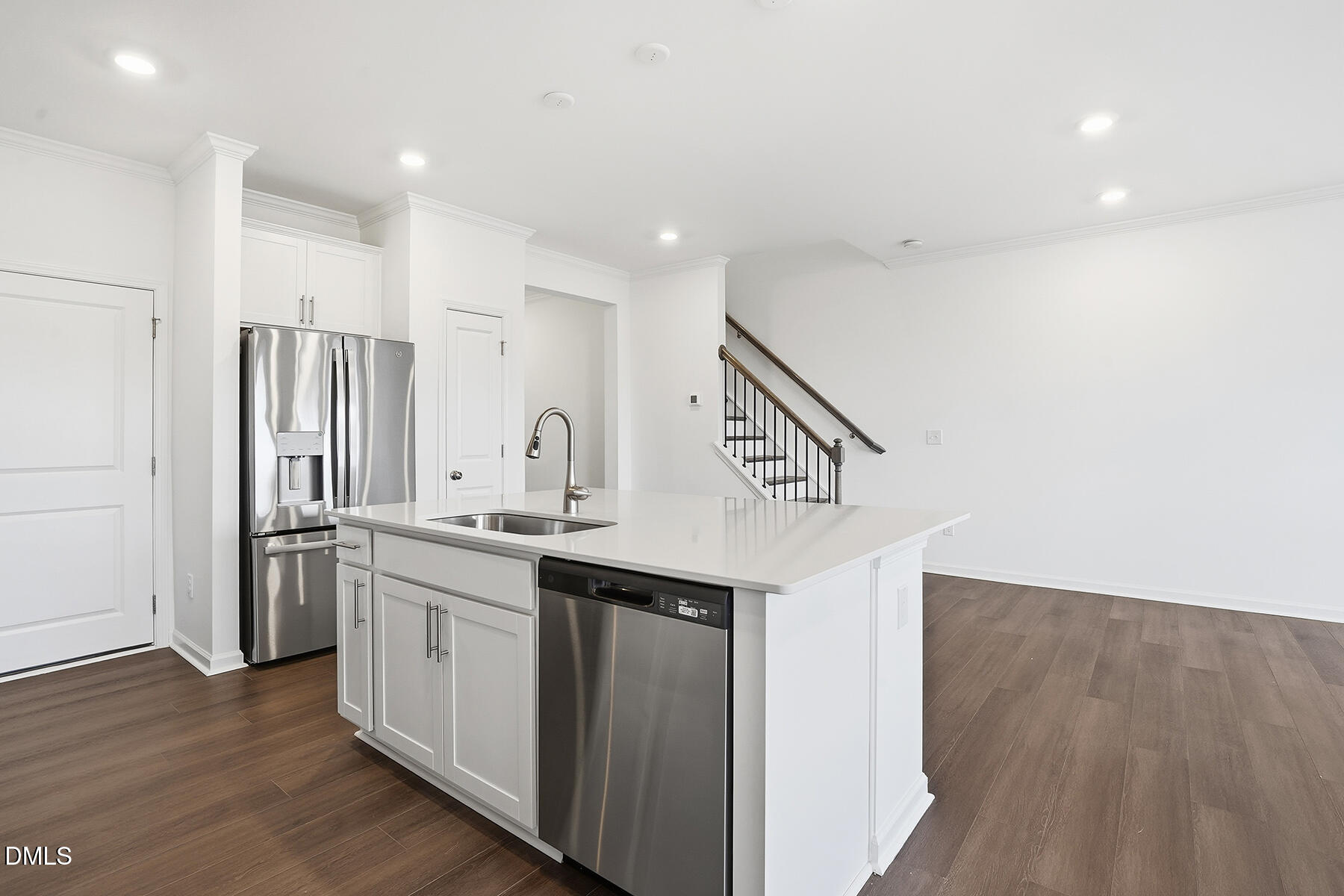 84 Blossom Fld Way Angier, NC 27501 - Photo 8 of 30 a kitchen with stainless steel appliances a sink and a refrigerator