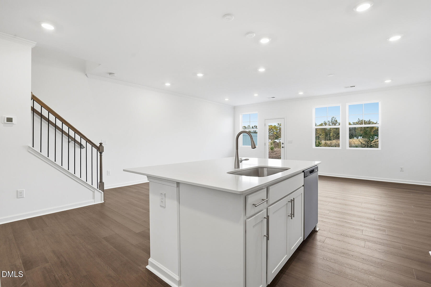 84 Blossom Fld Way Angier, NC 27501 - Photo 9 of 30 a kitchen with a sink window and wooden floor