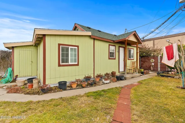 a front view of a house with sitting space