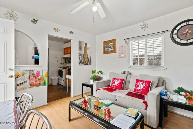 a living room with furniture and a window