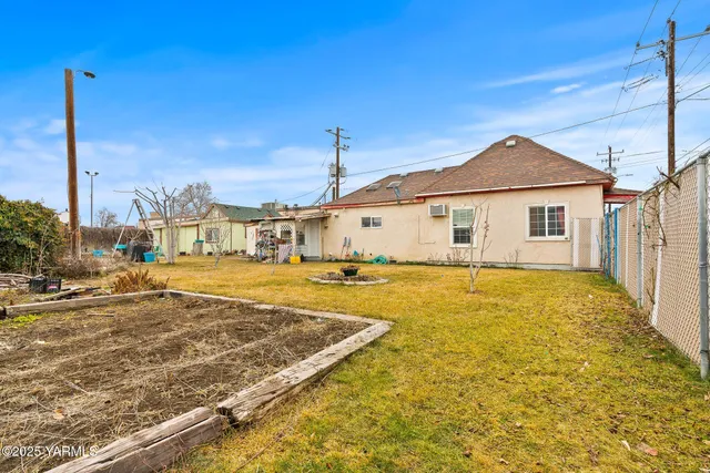 a bathroom with a sink and mirror next to it