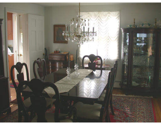 7 Timber Lane Topsfield, MA 01983 - Photo 6 of 10 a view of a dining room with furniture and chandelier