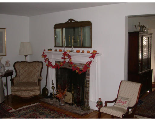 7 Timber Lane Topsfield, MA 01983 - Photo 8 of 10 a living room with furniture and a mirror