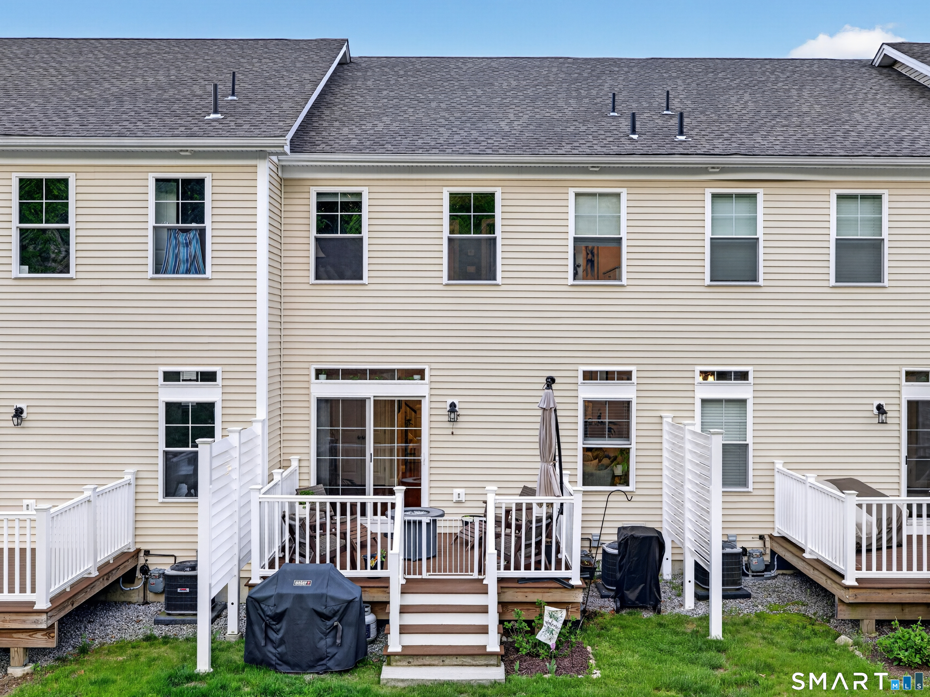 34 Village Crossing, Unit 34 Niantic, CT 06357 - Photo 34 of 38 a front view of a house with garden and porch