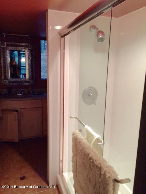 Whengreen Road Nicholson, PA 18446 - Photo 18 of 24 a bathroom with a glass shower door and a sink