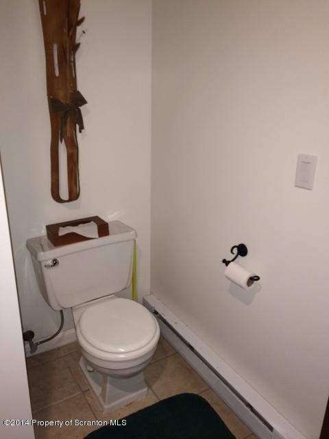 Whengreen Road Nicholson, PA 18446 - Photo 22 of 24 a white toilet sitting next to a shower