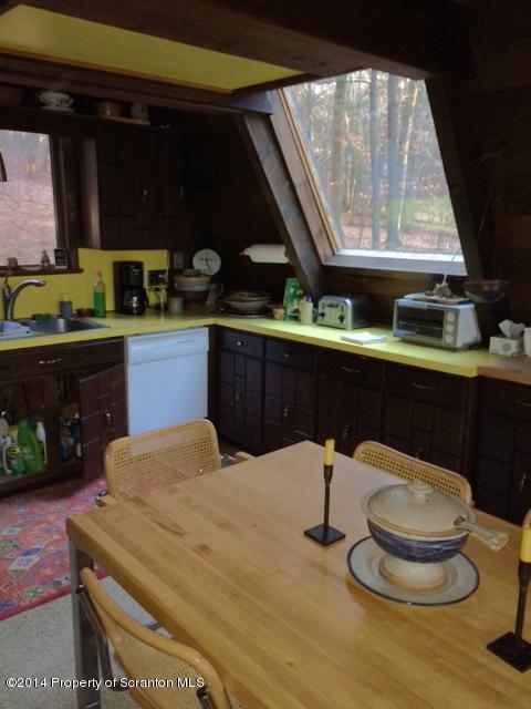Whengreen Road Nicholson, PA 18446 - Photo 3 of 24 a kitchen with a sink and wooden cabinets