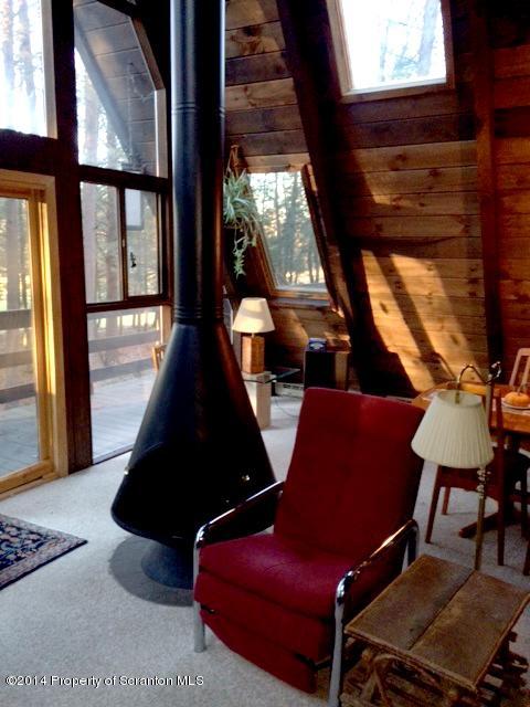 Whengreen Road Nicholson, PA 18446 - Photo 7 of 24 a living room with furniture and a floor to ceiling window