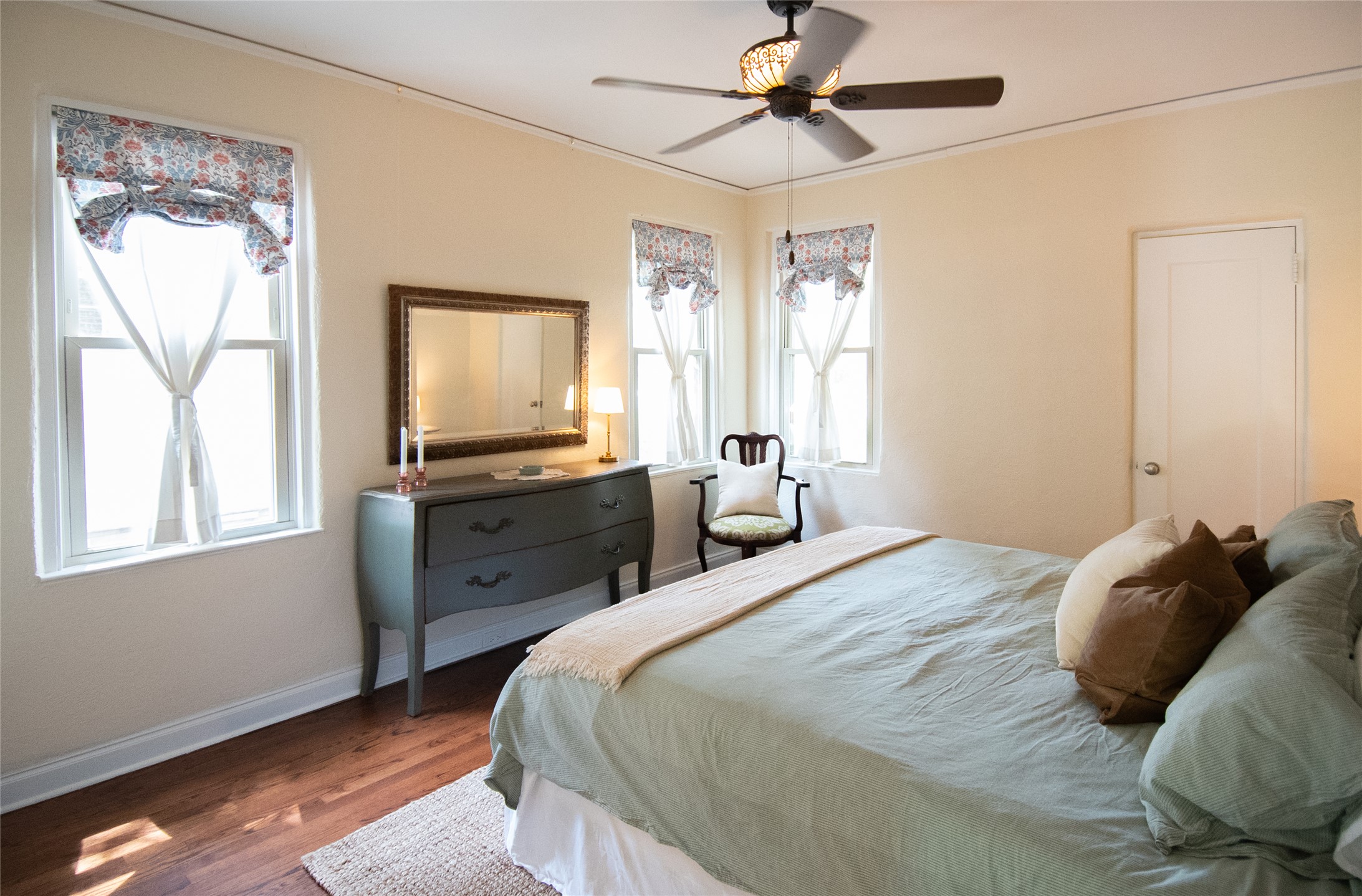 1512 Northwood Road Austin, TX 78703 - Photo 7 of 24 Bedroom with wood finished floors, ornamental molding, and a ceiling fan