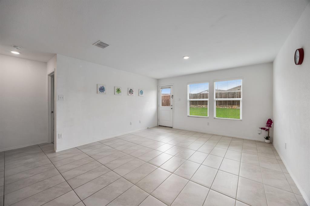 6038 Determine Lane Forney, TX 75126 - Photo 11 of 26 Spacious interior room featuring tile flooring, white walls, and recessed lighting