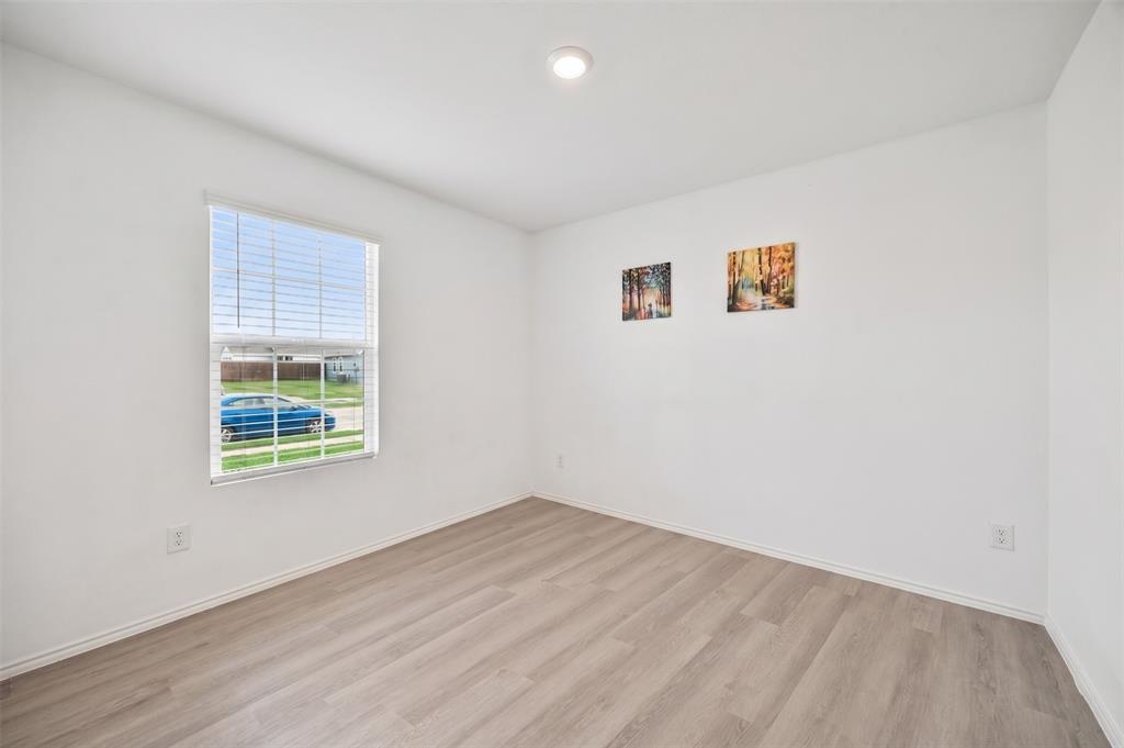 6038 Determine Lane Forney, TX 75126 - Photo 20 of 26 Interior room featuring light wood-finish flooring, white walls, and a recessed ceiling light