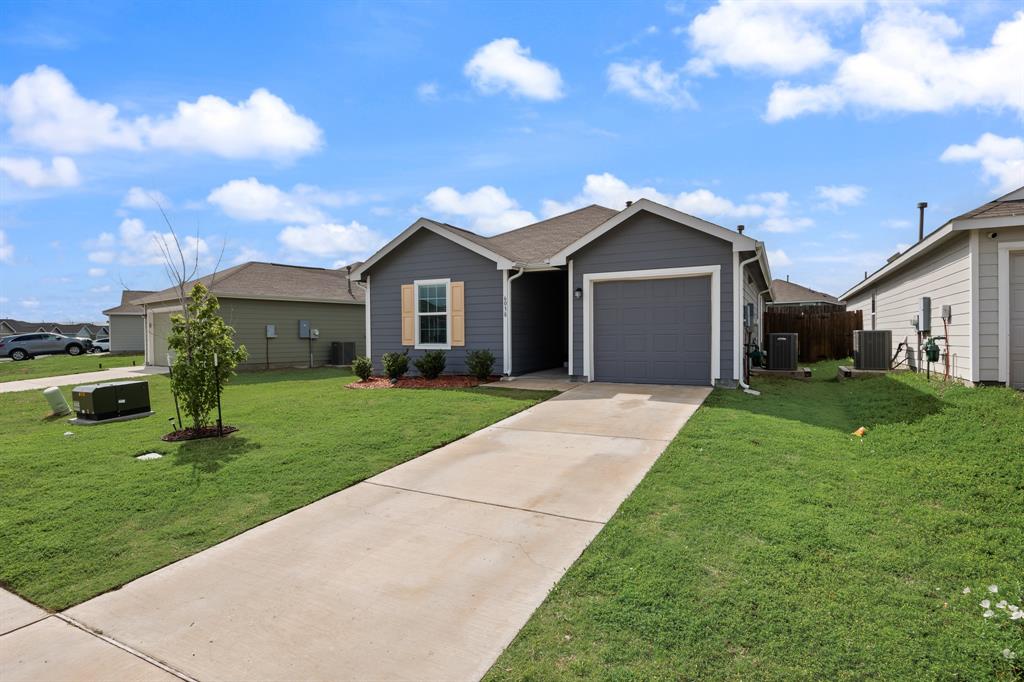 6038 Determine Lane Forney, TX 75126 - Photo 2 of 26 Single-story residence featuring a gray exterior siding and a front-facing attached garage
