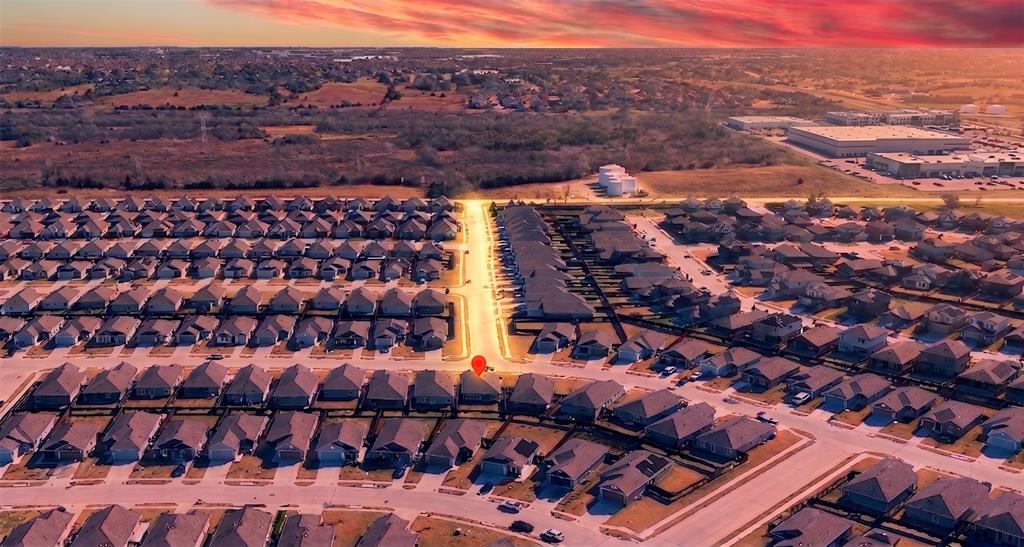 6038 Determine Lane Forney, TX 75126 - Photo 24 of 26 Aerial perspective showcasing a residential community with uniform architectural styles