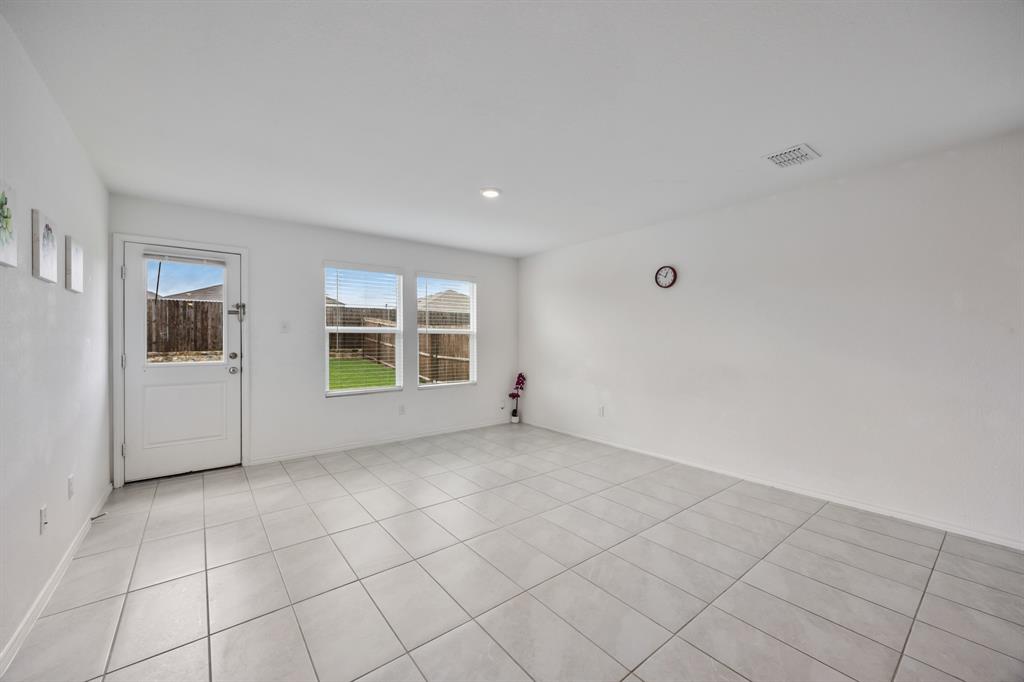 6038 Determine Lane Forney, TX 75126 - Photo 10 of 26 Spacious room featuring light-toned tile flooring, recessed ceiling lighting, and multiple windows with blinds