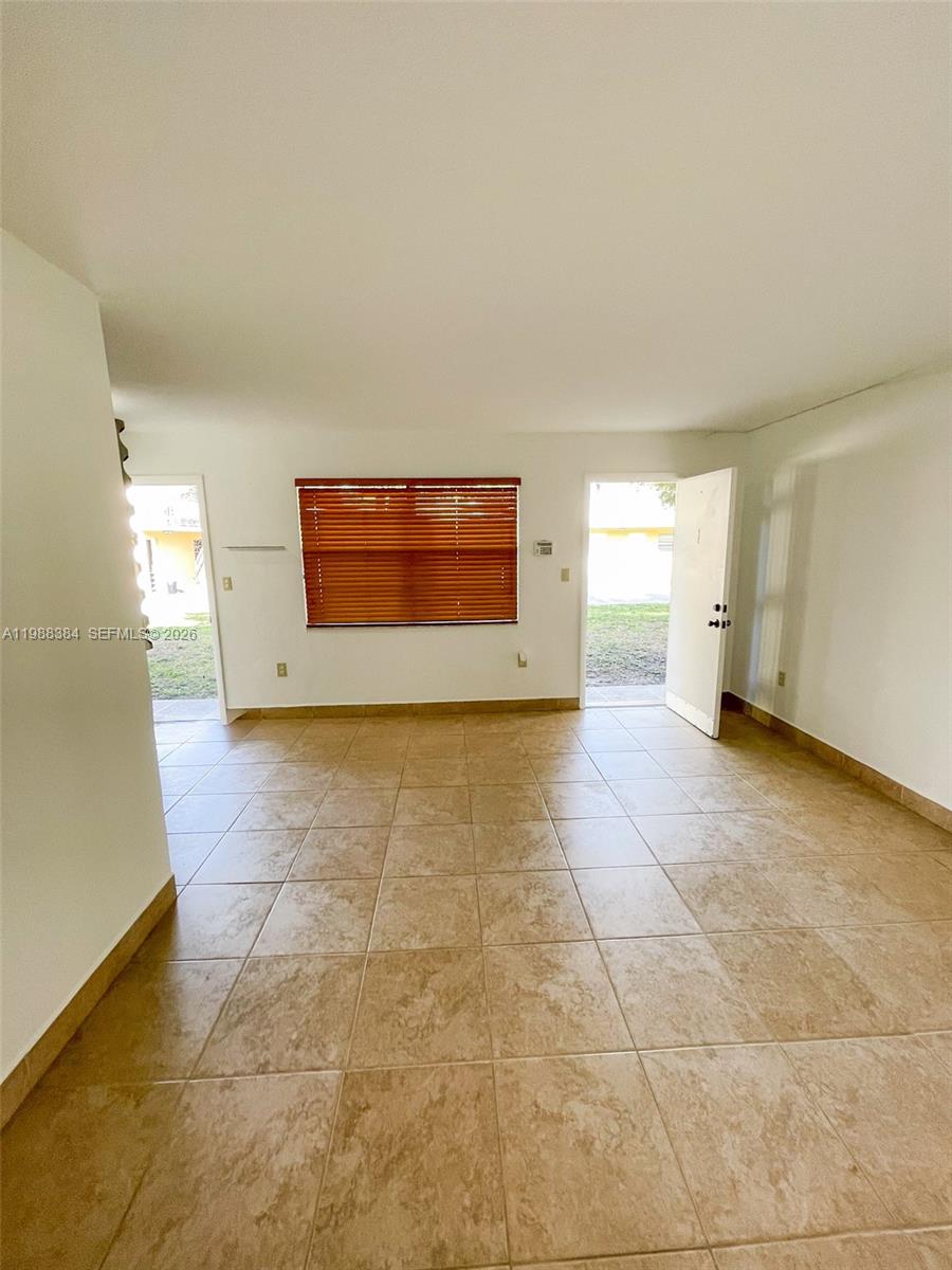 4450 Southwest 67th Avenue, Unit I Miami, FL 33155 - Photo 7 of 12 a view of an empty room