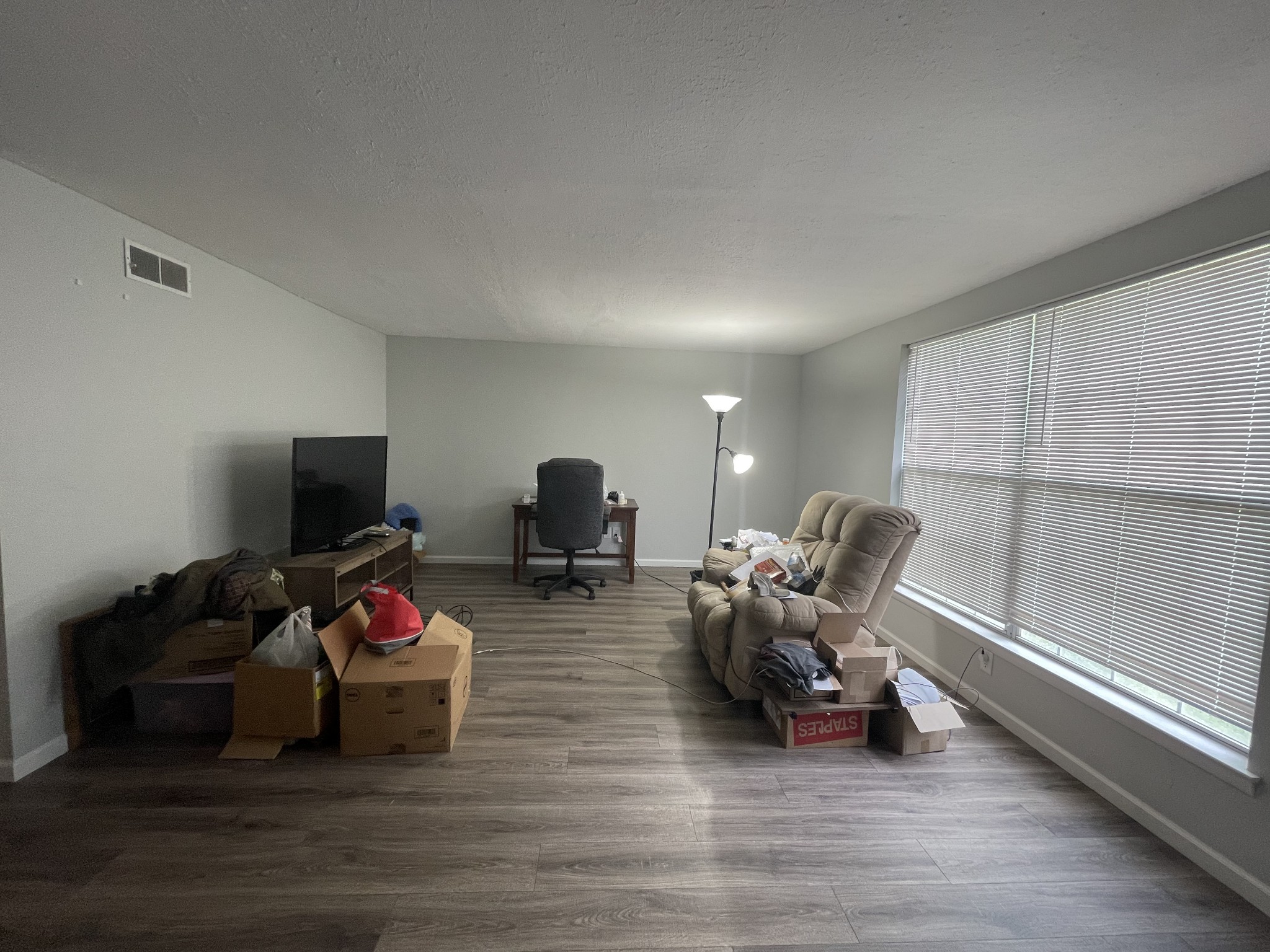 1301 Neelys Bend Road, Unit 71 Madison, TN 37115 - Photo 3 of 7 a living room with furniture a flat screen tv and a window