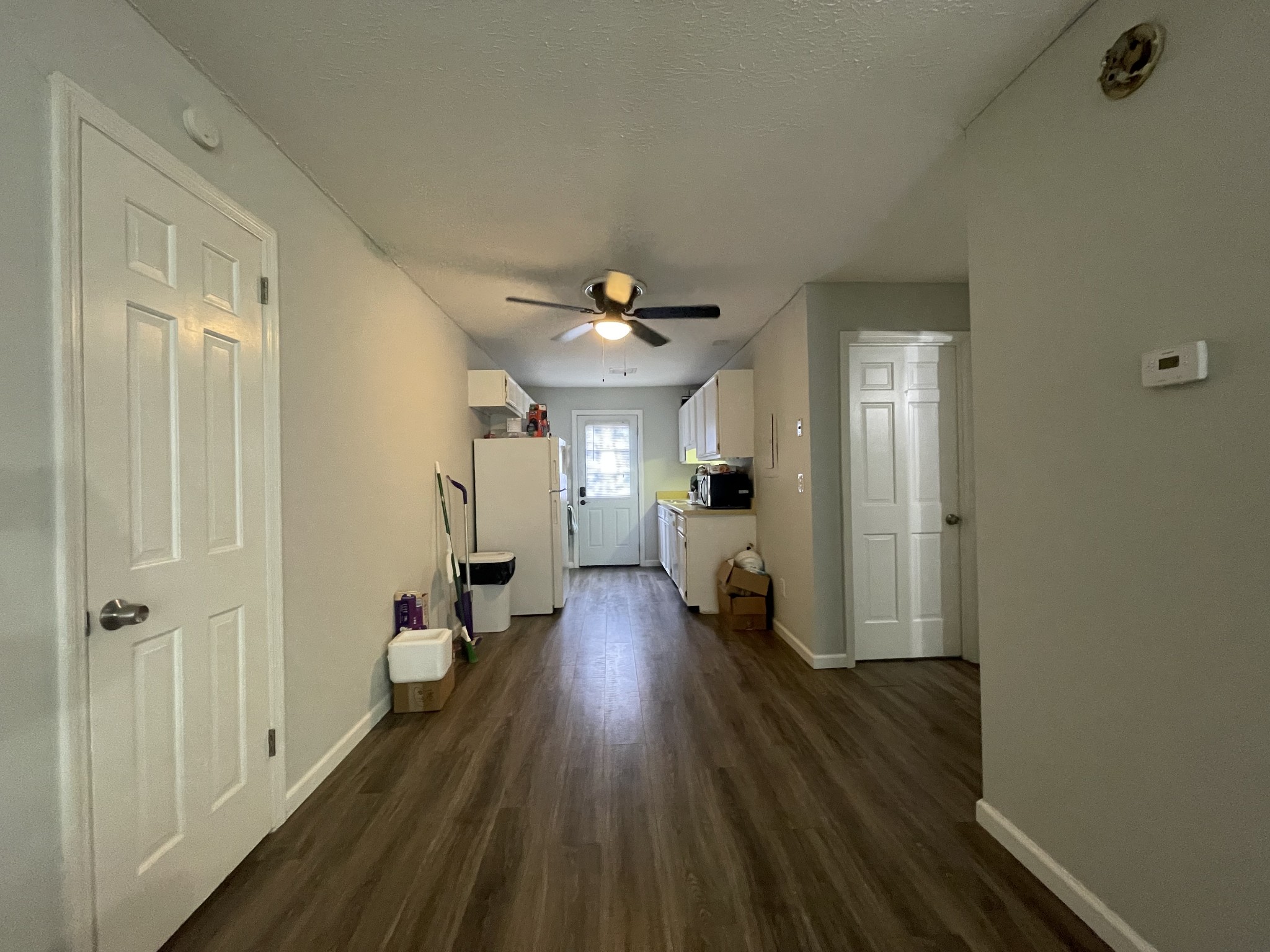 1301 Neelys Bend Road, Unit 71 Madison, TN 37115 - Photo 4 of 7 a view of a hallway with wooden floor and a bathroom