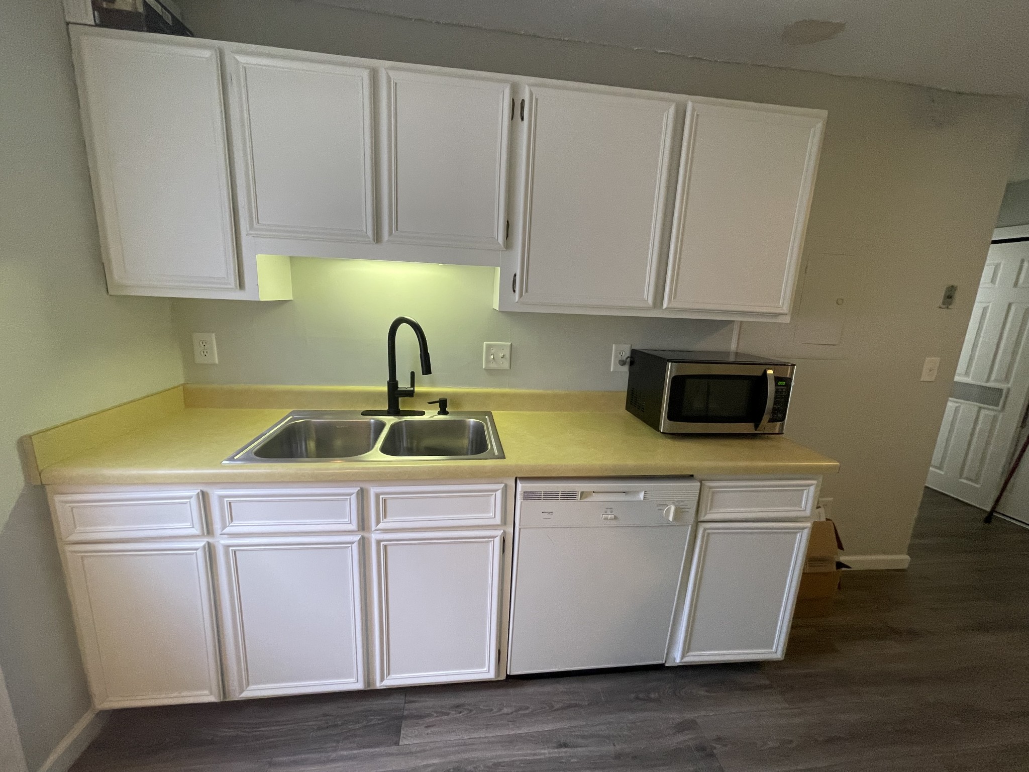1301 Neelys Bend Road, Unit 71 Madison, TN 37115 - Photo 6 of 7 a kitchen with cabinets appliances and a sink