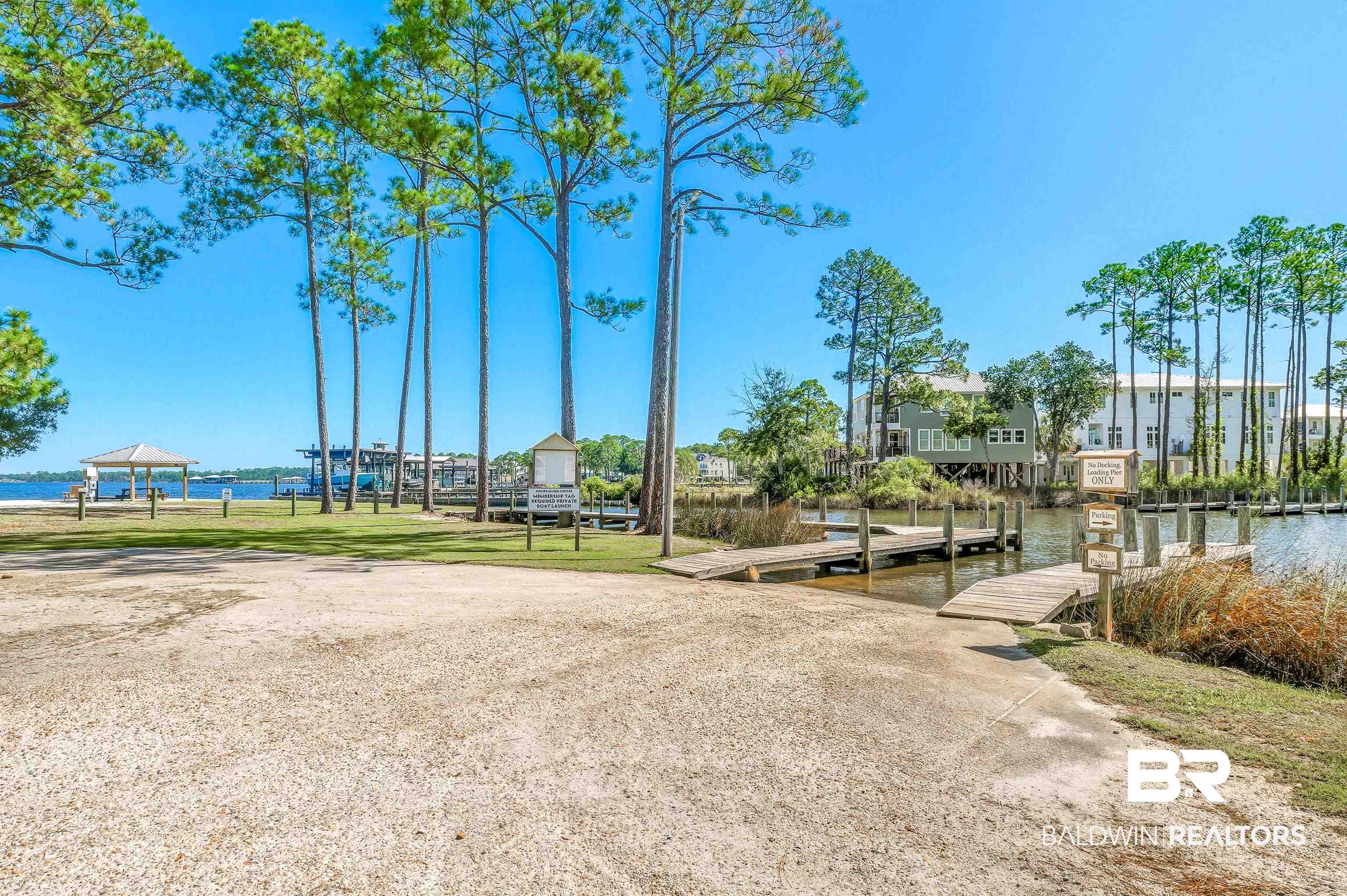 5310 Pine Road Orange Beach, AL 36561 - Photo 23 of 46 View of home's community featuring a water view, a boat dock, and a boat ramp
