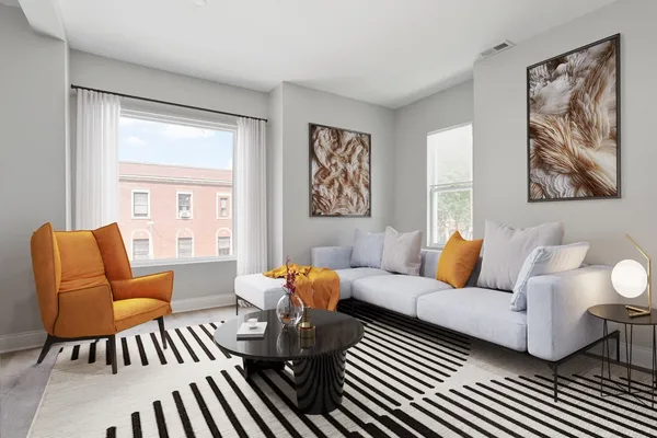 a living room with furniture and a large window